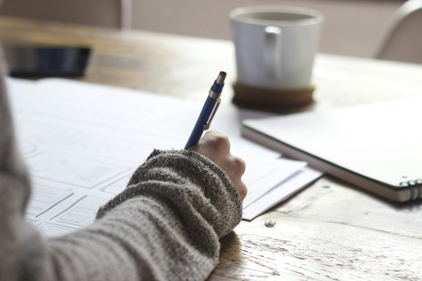 Close-up of a notebook and pen during AI budget course planning